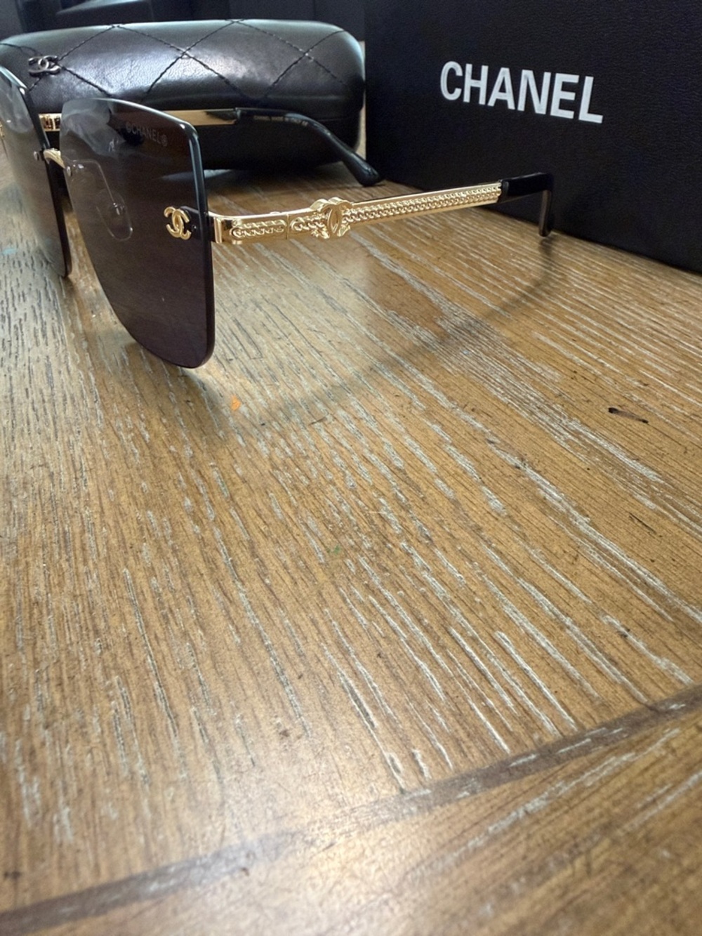 Chanel Women's Black and Gold Rimless Square Sunglasses - Picture 5 of 9